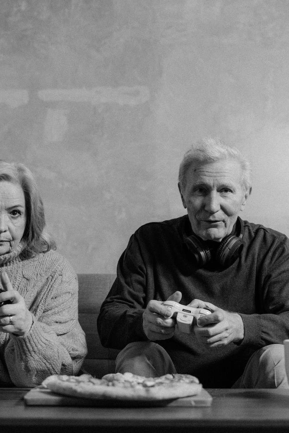 grayscale_photo_of_elderly_man_and_woman_playing_v